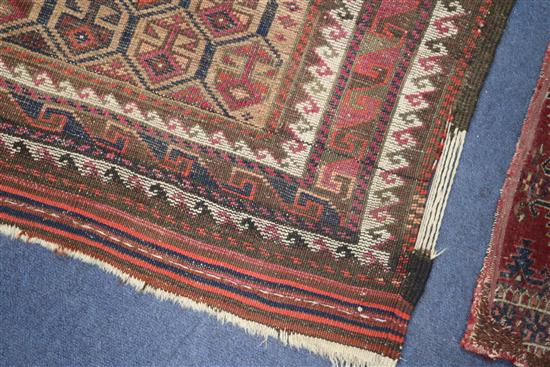 A Shiraz rug, a Bokhara saddlecloth and another rug (wear)